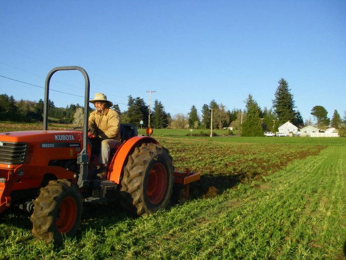 bryan uses the chisel plow to break up the soil on this sunny april day